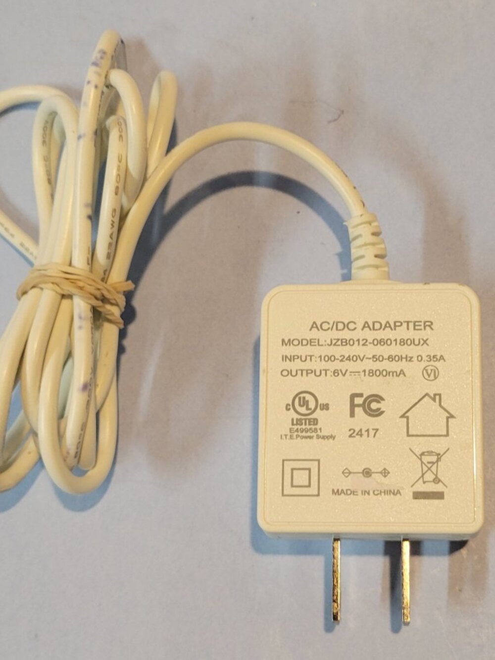 AC/DC Adapter Model JZB012-060180UX 6V 1800mA